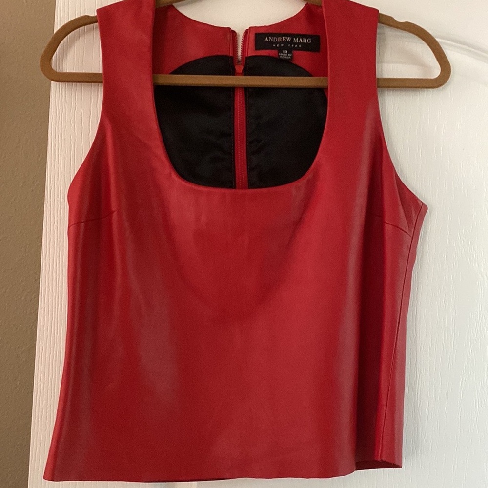 Andrew Marc fully lined Leather sleeveless top with zipper in the back.